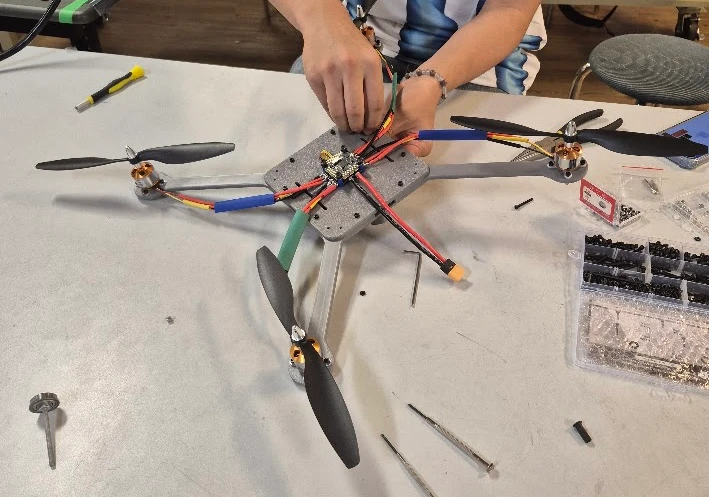 First quadcopter frame being assembled