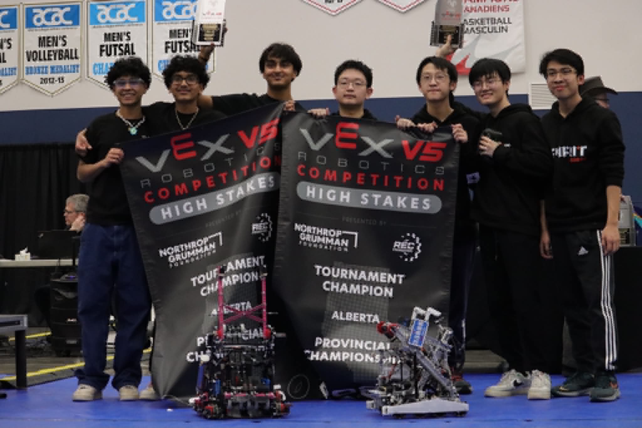 Team 3388S holding the provincial champion banners